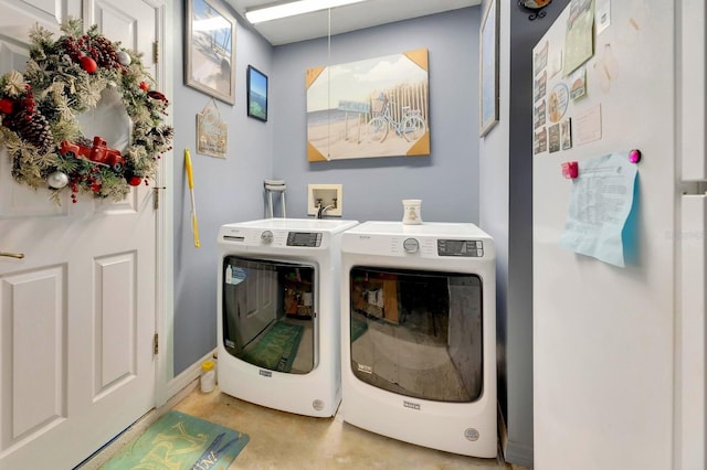 clothes washing area featuring washing machine and dryer