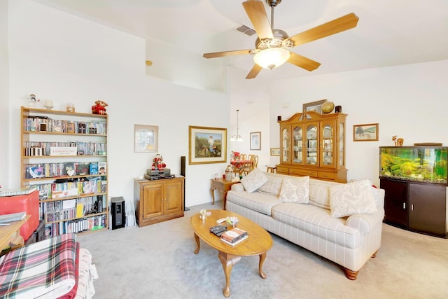 carpeted living room featuring ceiling fan