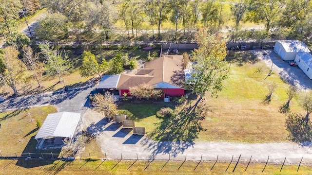 birds eye view of property with a rural view