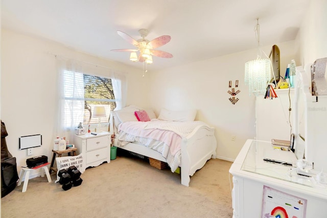 bedroom featuring ceiling fan and light colored carpet