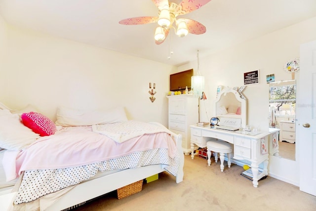 bedroom featuring light colored carpet and ceiling fan