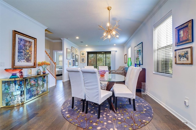 dining area with dark hardwood / wood-style flooring, a chandelier, and ornamental molding