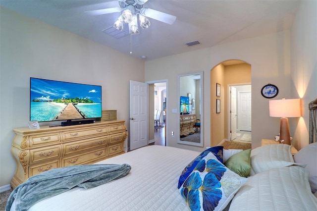 carpeted bedroom featuring ceiling fan and connected bathroom