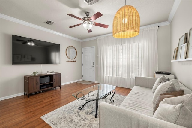 10334 Estero Bay Ln, Tampa, FL 33625 - living room with ceiling fan, crown molding, wood finished floors, and baseboards