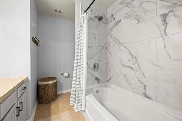 bathroom featuring shower / bath combination with curtain, vanity, a textured ceiling, and tile patterned floors