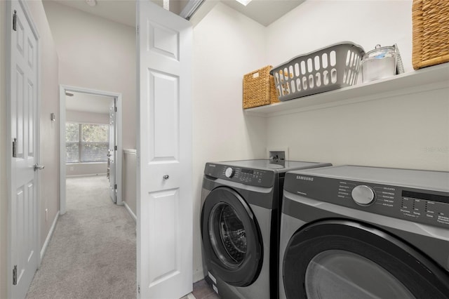 laundry room with light carpet and washing machine and clothes dryer