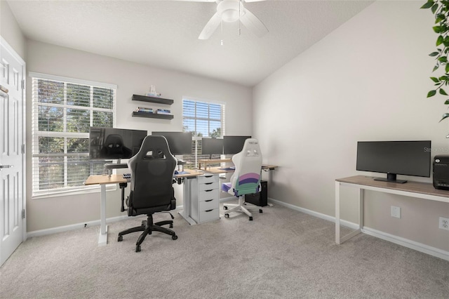 carpeted office featuring ceiling fan and lofted ceiling