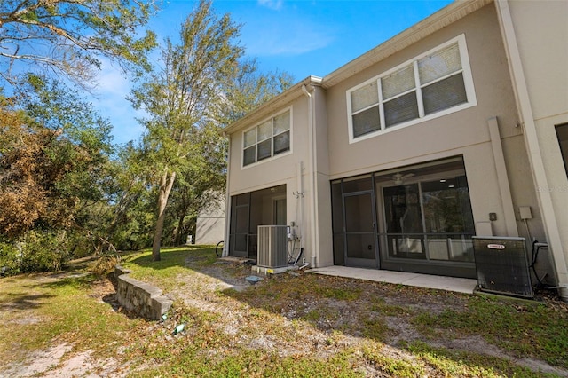 10334 Estero Bay Ln, Tampa, FL 33625 - rear view of property with central AC unit and stucco siding