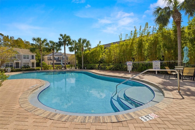 10334 Estero Bay Ln, Tampa, FL 33625 - community pool with a patio area