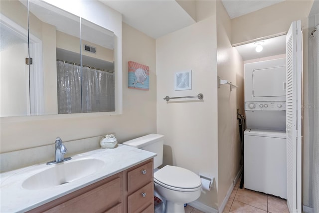 bathroom with stacked washing maching and dryer, tile patterned flooring, toilet, vanity, and a shower with shower curtain