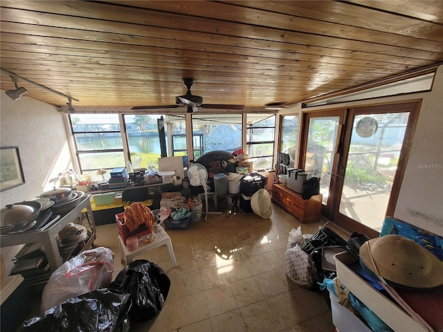 sunroom with a wealth of natural light, ceiling fan, wood ceiling, and vaulted ceiling