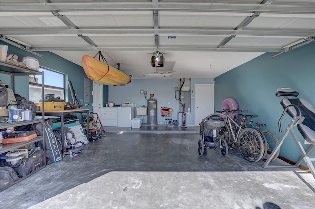 garage featuring washer and clothes dryer and water heater