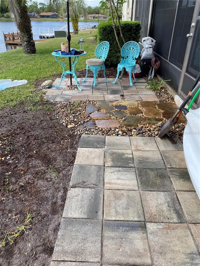 view of patio / terrace with a water view