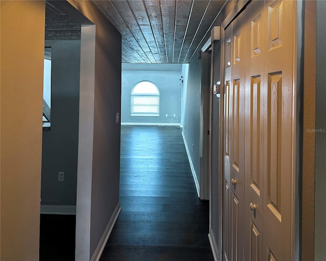 hall featuring wooden ceiling and dark wood-type flooring