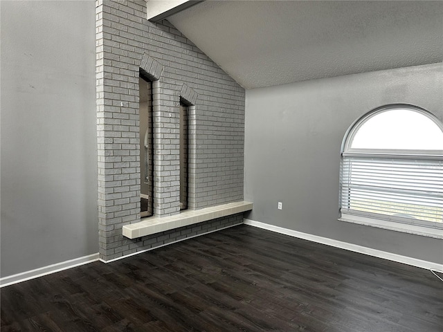 mudroom featuring a textured ceiling, vaulted ceiling with beams, and dark hardwood / wood-style floors