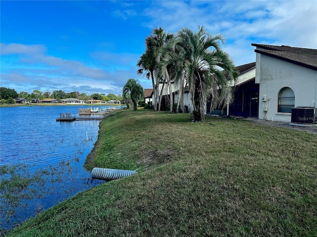 exterior space featuring a water view, central AC unit, and a boat dock