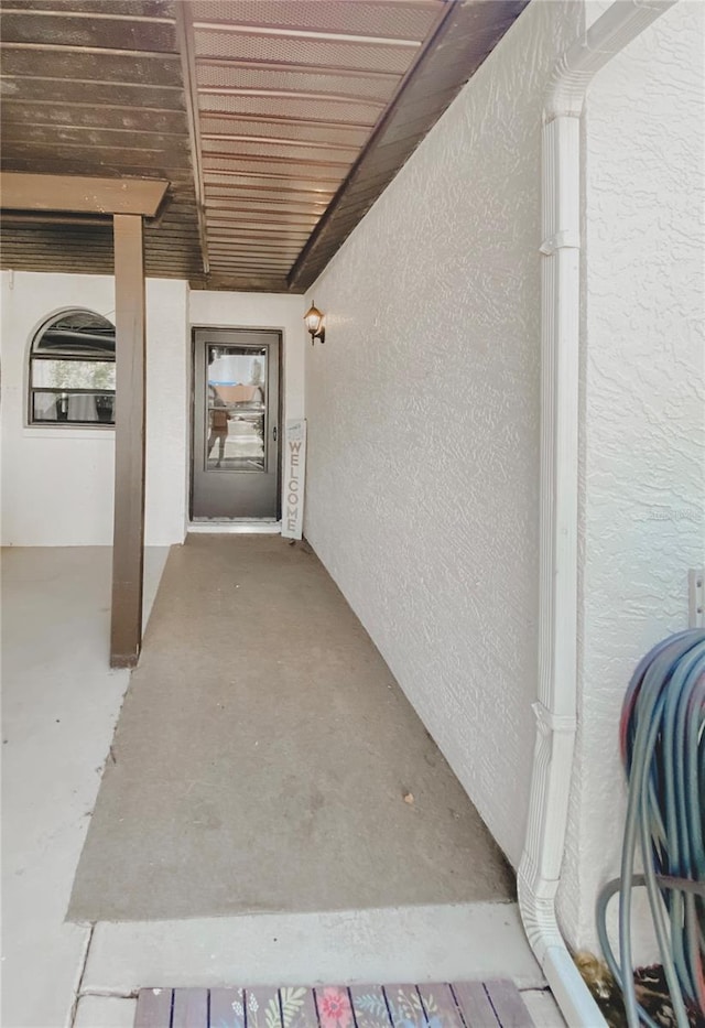 9107 Lingrove Rd, Weeki Wachee, FL 34613 - doorway to property featuring stucco siding