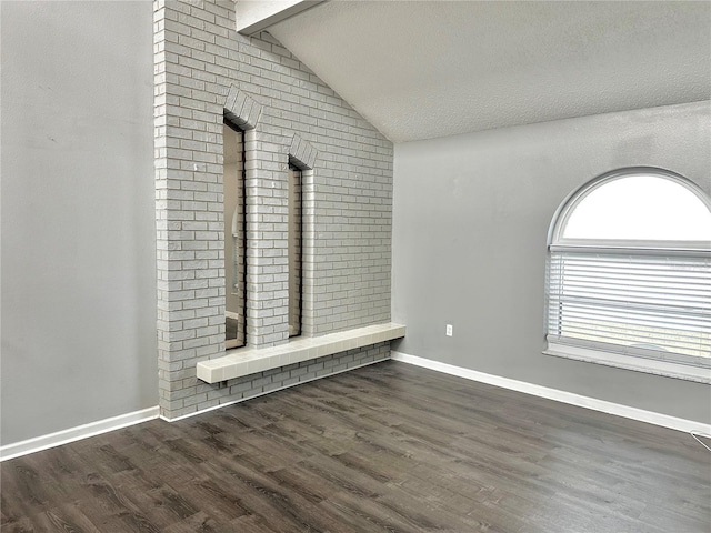 9107 Lingrove Rd, Weeki Wachee, FL 34613 - unfurnished living room featuring lofted ceiling with beams, baseboards, and wood finished floors