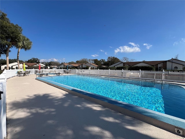 9107 Lingrove Rd, Weeki Wachee, FL 34613 - pool featuring a patio, fence, and a residential view