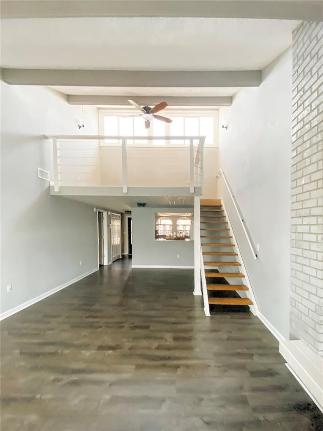 9107 Lingrove Rd, Weeki Wachee, FL 34613 - unfurnished living room featuring visible vents, baseboards, and stairs