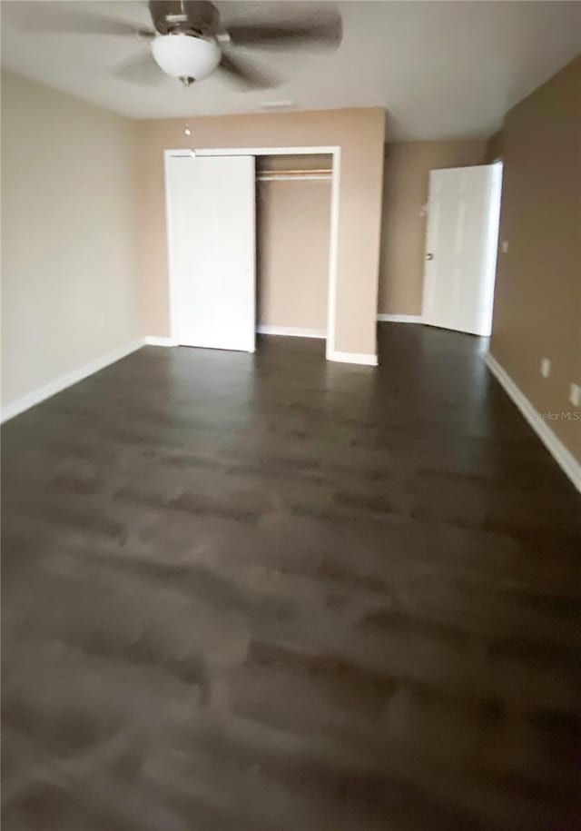 9107 Lingrove Rd, Weeki Wachee, FL 34613 - unfurnished bedroom with a ceiling fan and baseboards