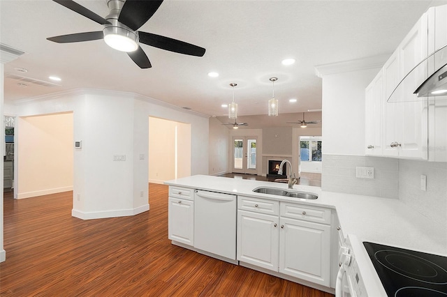 kitchen featuring white appliances, dark wood-type flooring, white cabinets, sink, and ornamental molding