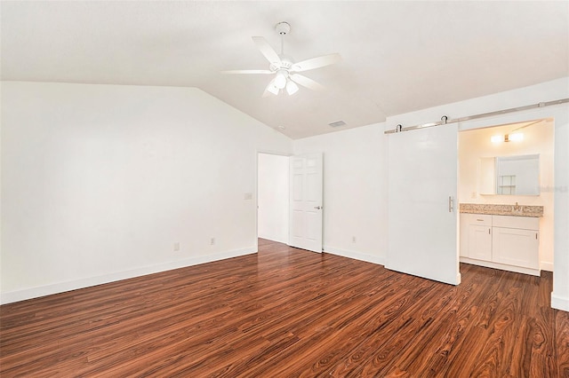 unfurnished room with vaulted ceiling, ceiling fan, and dark wood-type flooring