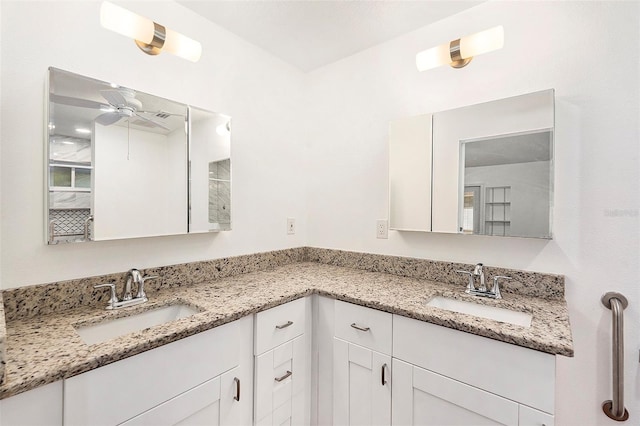 bathroom featuring ceiling fan and vanity