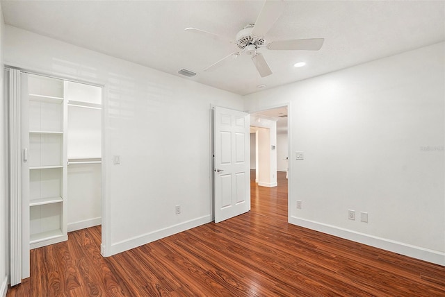 unfurnished bedroom featuring ceiling fan, wood-type flooring, and a closet