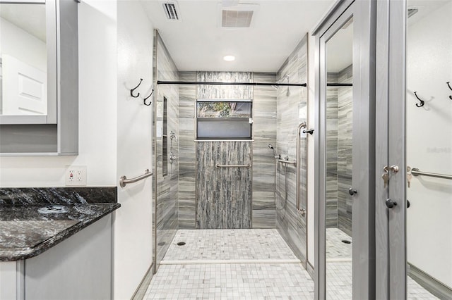 bathroom with vanity and walk in shower