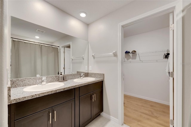 bathroom featuring vanity and hardwood / wood-style flooring