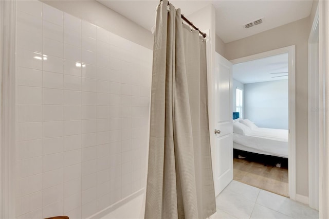 bathroom featuring tile patterned floors and a shower with shower curtain