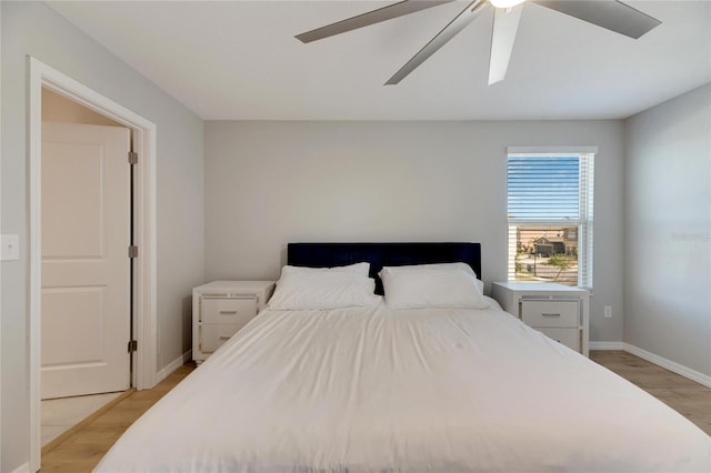 bedroom featuring light hardwood / wood-style flooring and ceiling fan