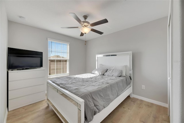 bedroom featuring light hardwood / wood-style floors and ceiling fan