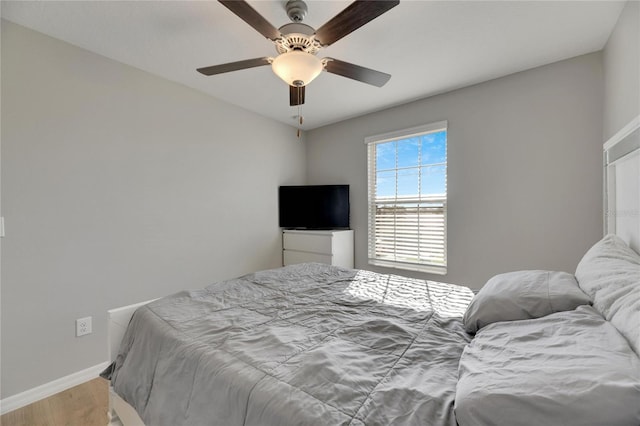 bedroom featuring light hardwood / wood-style flooring and ceiling fan