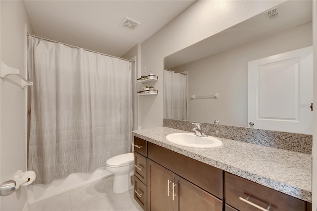 bathroom with tile patterned floors, walk in shower, vanity, and toilet