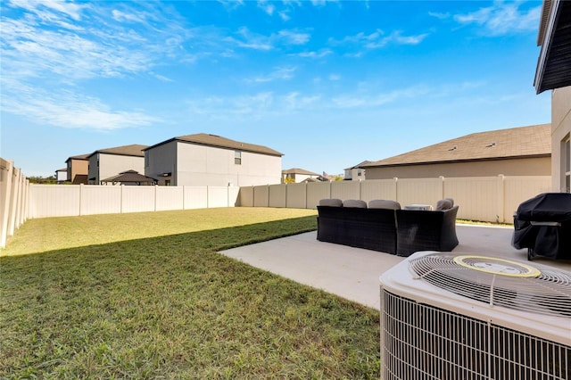 view of yard featuring a patio area and central air condition unit