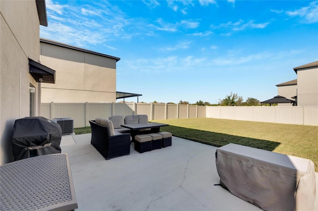 view of patio with area for grilling and central AC