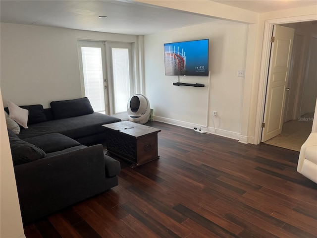 living room with french doors and dark hardwood / wood-style floors