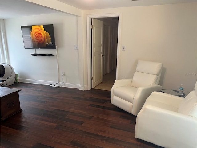 sitting room featuring dark hardwood / wood-style flooring