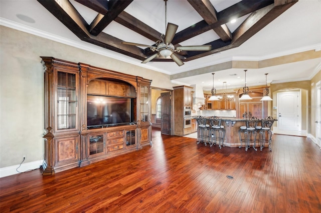 living room featuring ceiling fan, coffered ceiling, beamed ceiling, dark hardwood / wood-style floors, and crown molding