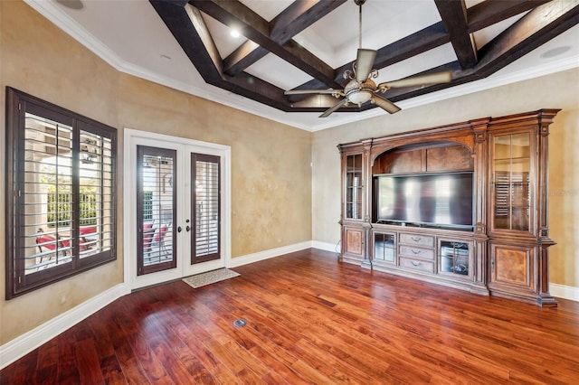 unfurnished living room featuring hardwood / wood-style floors, french doors, coffered ceiling, crown molding, and beam ceiling