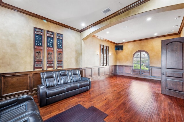 living room with dark hardwood / wood-style flooring and ornamental molding