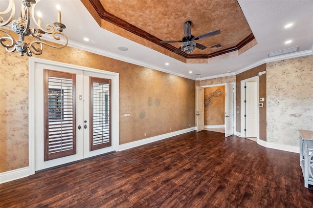 unfurnished living room with french doors, a raised ceiling, dark hardwood / wood-style floors, crown molding, and ceiling fan with notable chandelier