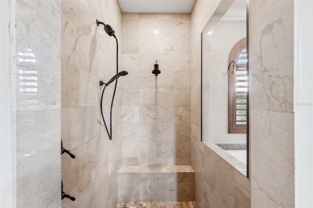 bathroom featuring a tile shower