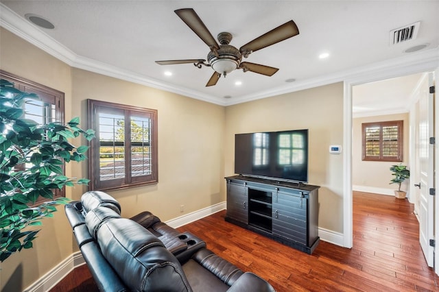 living room featuring ceiling fan, crown molding, and dark wood-type flooring