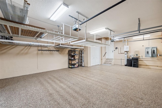 garage with a garage door opener and electric panel