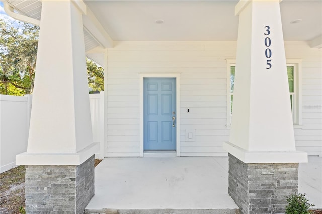 doorway to property featuring covered porch