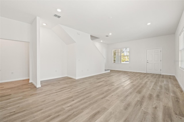 unfurnished living room featuring light hardwood / wood-style floors