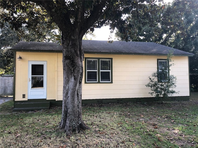 605 Alberta Ave, Auburndale, FL 33823 - view of front of home with crawl space, entry steps, and a shingled roof